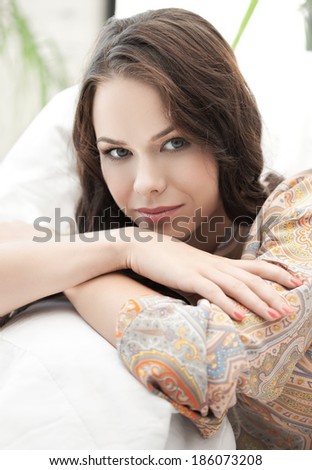 bright closeup picture of relaxed woman at home