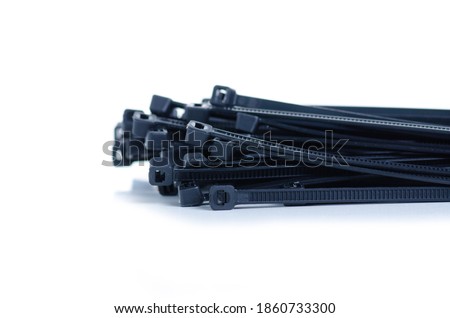 Black plastic ties clamps on white background isolation