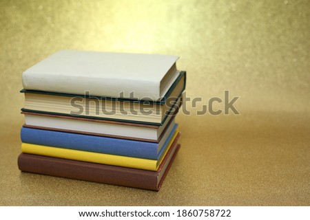 Books on a gold background