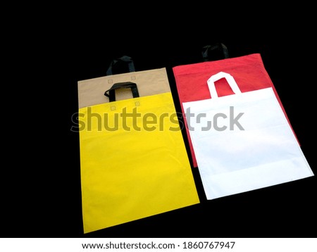 Non Woven Colorful Bags With Loop Handles. Single Use Environment Packaging Bags. Shopping Sale Banners