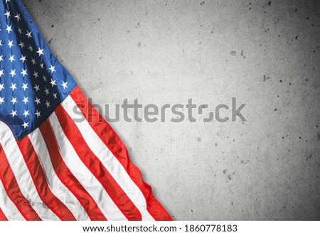 Happy Veterans Day concept. American flags against gray stone  background. November 11.
