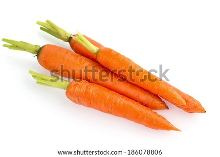 organically grown carrots lying on white background. fresh fruit and vegetables are always healthy.