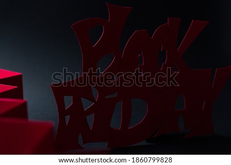black friday on black background and lettering in red color