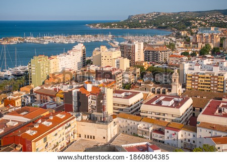 Denia cityscape. Aerial view from the historic moorish castle mirador in the old town that holds the Palau del Governador. Costa Blanca, Alicante province, Valencian community, Spain.  Royalty-Free Stock Photo #1860804385