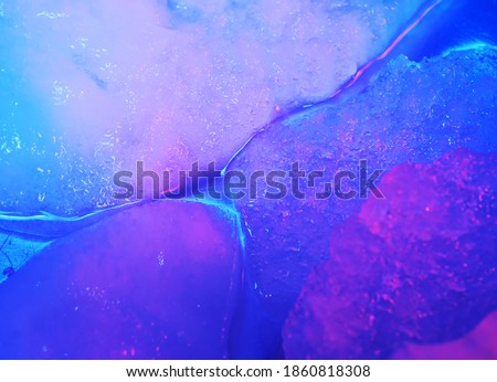 Ice floating texture. Gel photography shot with blue, purple colors. Ideal as a background for adverising alcohol drinks