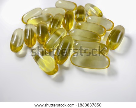 Omega-3 capsules on a white background. Polyunsaturated fatty acids. The concept of a healthy lifestyle. Great for magazines and websites in the style of healthy, as well as in medicine.