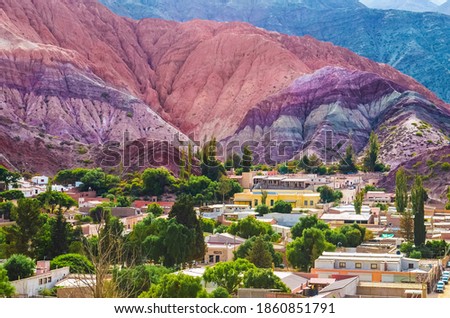 Stock photo of houses from the village of Purmamarca in Jujuy, Argentina. Landscape with colored mountains and hills Royalty-Free Stock Photo #1860851791