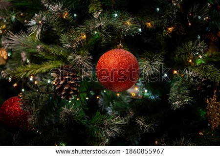 Close up of Isolated Red bobble on christmas tree. chirstmas concept. living room tree. Royalty-Free Stock Photo #1860855967