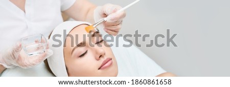 Cosmetology beauty procedure. Young woman skin care. Beautiful female person. Rejuvenation treatment. Facial chemical peel therapy. Clinical healthcare. Doctor hand. Dermatology cleanser. Copyspace Royalty-Free Stock Photo #1860861658