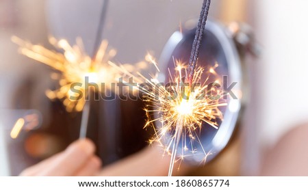 Bengal fire on light background with reflection