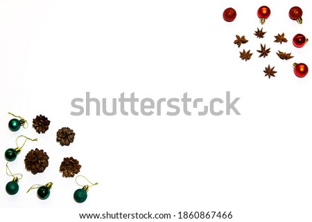 Christmas composition. Red and green decorations with pines and stars on white background. Christmas, winter, new year concept. Flat lay.