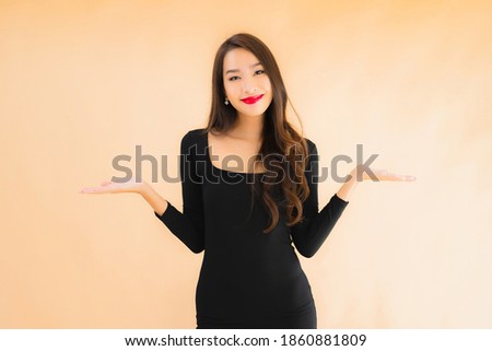 Portrait beautiful young asian woman happy smile in action on color isolated background
