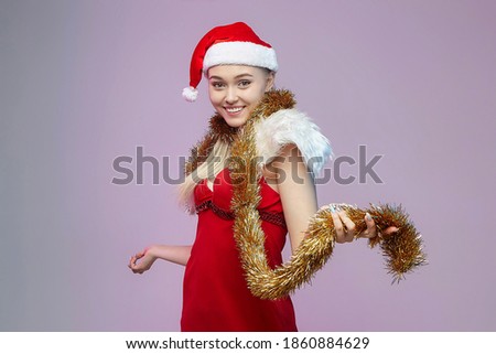 happy young girl woman in Santa costume. photo session in the Studio