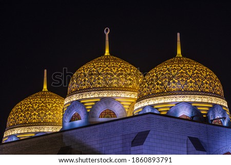 Middle East, Arabian Peninsula, Oman, Muscat, Bawshar. Evening view of the Muhammad Al Ameen Mosque in Bawshar, Muscat. Royalty-Free Stock Photo #1860893791