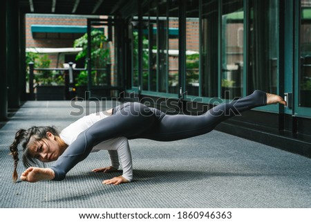 Young woman practice yoga in the park