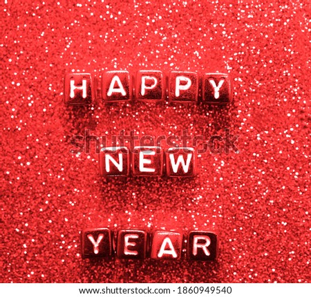 HAPPY NEW YEAR 2021 written with colorful cube.  Alphabet Beads on glitter  Background