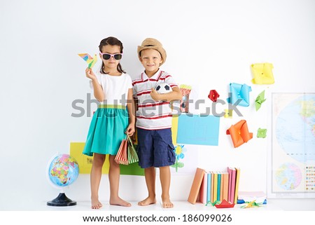Little boy and girl ready for journey Royalty-Free Stock Photo #186099026