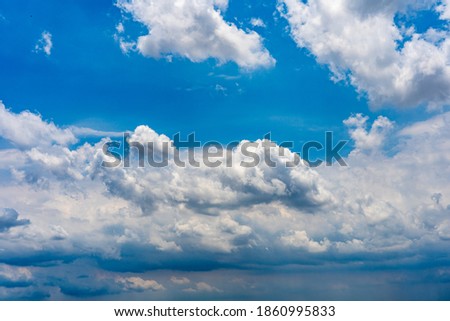 Dramatic cloudy sky background with white clouds floating