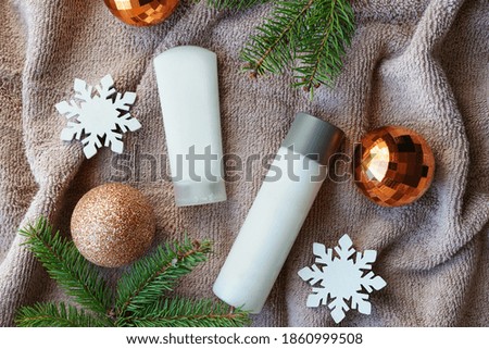 christmas cosmetic products on towel, flat lay. Winter care