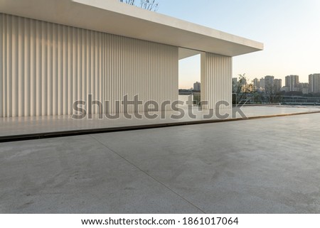 empty marble ground and cityscape of modern city. Royalty-Free Stock Photo #1861017064