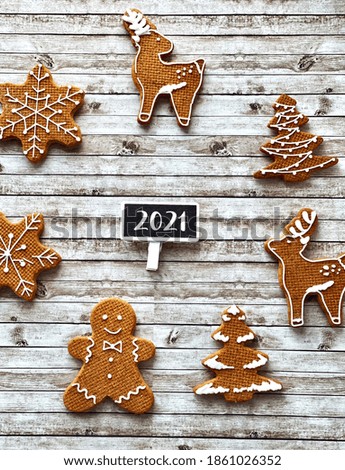 Group of cute gingerbread cookies for Christmas and 2021 sign 