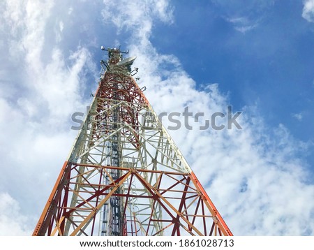 Signal tower or Mobile phone tower with dayligth sky and white cloud. Telecommunication tower Antenna.Modern communication concept by using 5 g internet Royalty-Free Stock Photo #1861028713