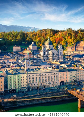 Attractive cityscape of Salzburg, Old City, birthplace of famed composer Mozart. Wonderful autumn scene of Eastern Alps. Gorgeous morning landscape with Salzach river.