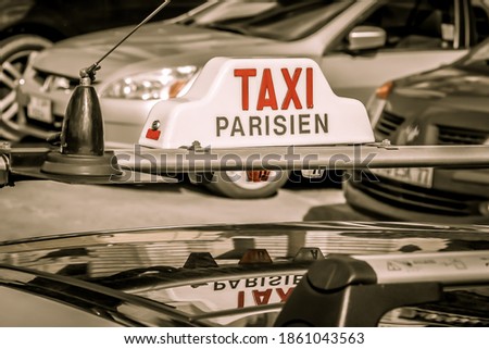 A Paris taxi. Lightbox on the roof of a taxi car in Paris. Close up. Selective focus. Paris, France