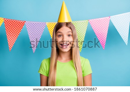 Photo of young happy excited positive good mood girl celebrating birthday wear cone cap isolated on blue color background