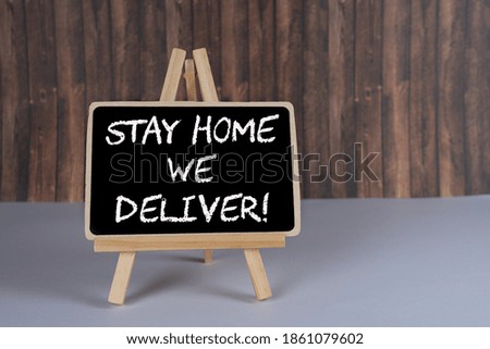 Black board with the inscription Stay home we deliver