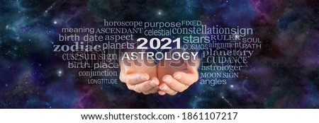 Your 2021 ASTROLOGY is written in the Stars - wide night sky deep space dark background with a pair of female hands cupped underneath the words 2021 ASTROLOGY  surrounded by a word cloud
