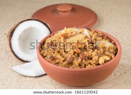 South Indian Sweet pongal made from rice, milk, jaggery and dry fruits.coconut sweet pongal Royalty-Free Stock Photo #1861120042