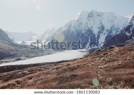 Beautiful mountain landscape sunny weather, mountains peaks in snow rocks