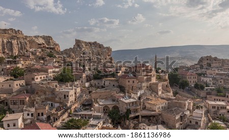 Urgup Town aerial view from Temenni Hill in Cappadocia Region of Turkey timelapse. Old houses and buildings in rocks at early morning panorama Royalty-Free Stock Photo #1861136986