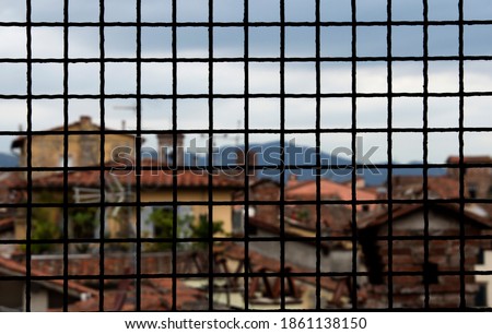 View From Guinigi Tower, Lucca, Italy. Focus over the Window Bars.