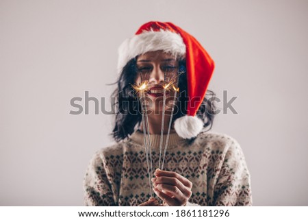 Portrait of young woman with christmas. Bokeh. Christmas woman. Smile. Photo. 