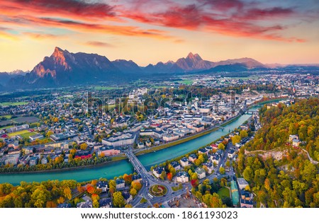 Aerial landscape photography. Exciting autumn view from flying drone of Salzburg, Old City. Spectacular sunrise on Eastern Alps. Fantastic morning landscape with Salzach river. 