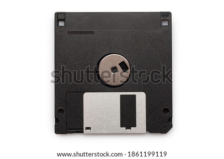 Floppy disk from black plastic isolated on white background. Outdated technology. Data storage diskette.