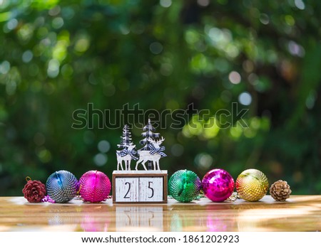 Christmas  decorations  and  ornament  on  wood  table  with  nature  blurry  background