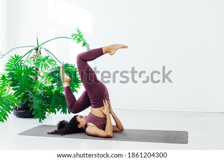 woman brunette engaged in yoga fitness asana body flexibility
