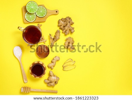 Citrus, ginger, honey, dried fruits. foods with vitamin C. Disease prevention. yellow background. Flat lay. copy space