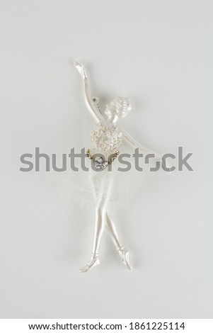 Christmas tree toy ballerina on white background