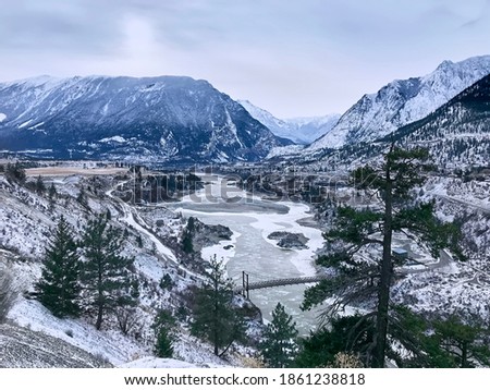 Fraser Valley in winter. Snow-capped mountains and a frozen river. View from the hill. Lillooet, British Columbia, Canada Royalty-Free Stock Photo #1861238818