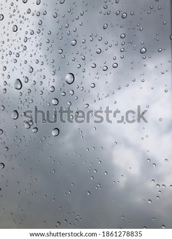 the drops on the glass finished the rain falling