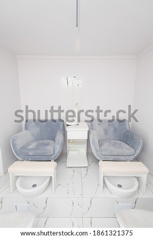 Interior of modern manicure salon without people. Luxury work places for masters of pedicure