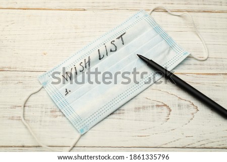Wishlist on a medical mask on a white background.