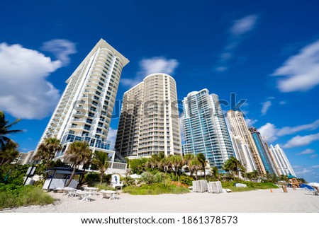 Beach side tall buildings Miami colorful blue sky