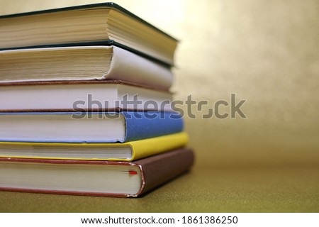 Books on a gold background