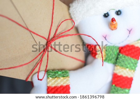 Christmas snowman and greeting envelope