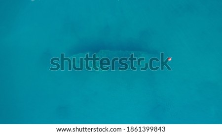 Sunken ship photographed from the air, is sunk at shallow depth Royalty-Free Stock Photo #1861399843